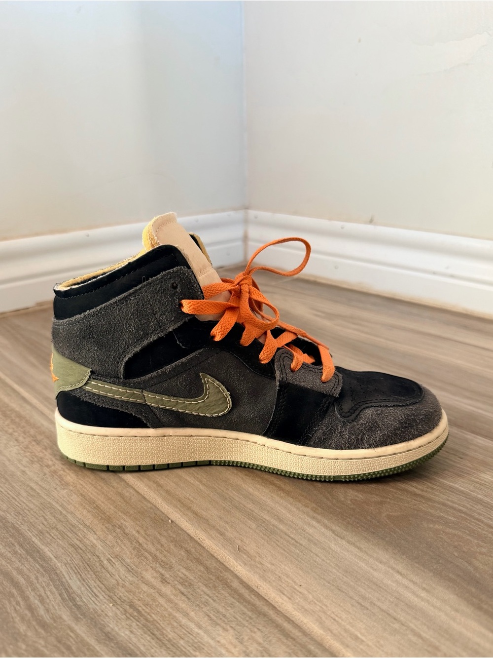 Nike Air Jordan’s Kids High-Top Sneakers in Black and Orange